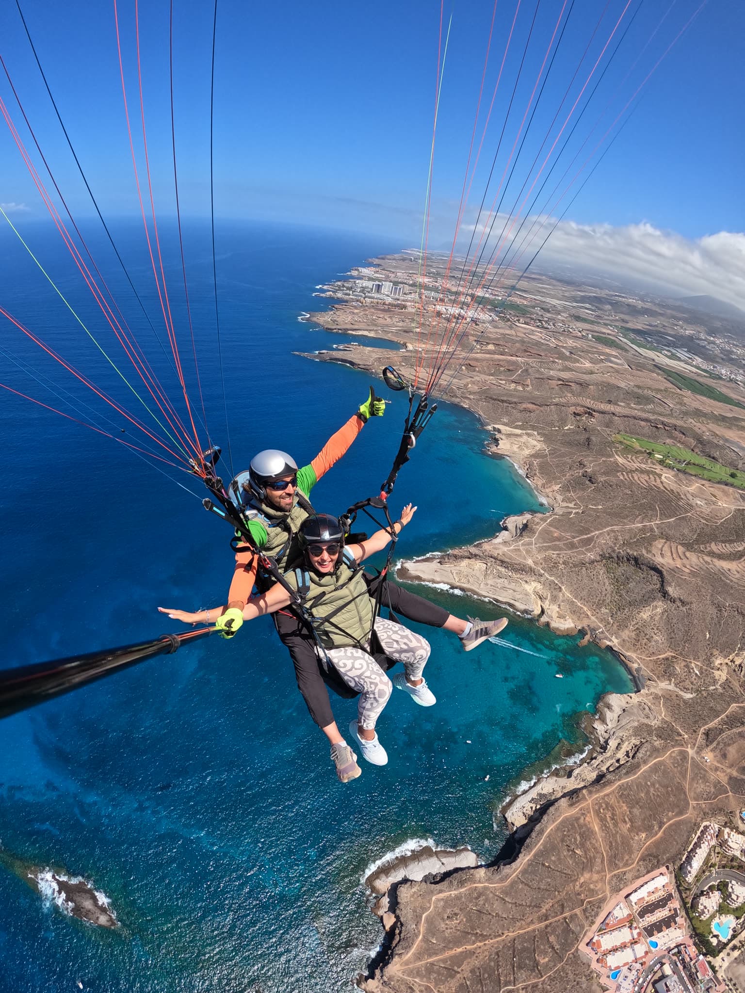 Tandem paraglider over the Costa Adeje coastline, Tenerife
